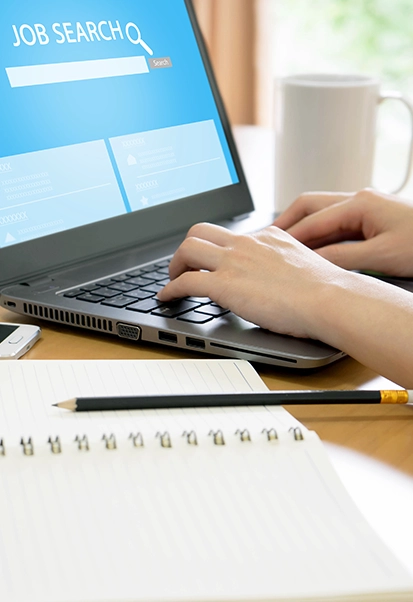 Job seeker completing an online job application form.